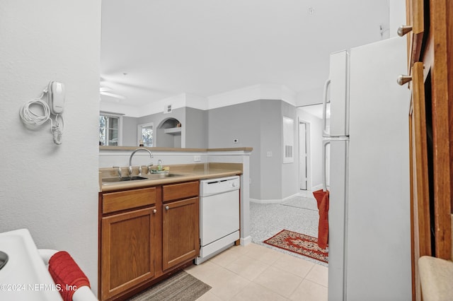 8550 Touchton Rd Unit 1226, Jacksonville, FL 32216 - kitchen featuring ceiling fan, sink, light tile patterned floors, and white appliances