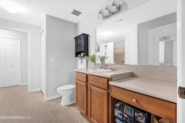 8550 Touchton Rd Unit 1226, Jacksonville, FL 32216 - bathroom featuring toilet, a shower, vanity, and tile patterned floors