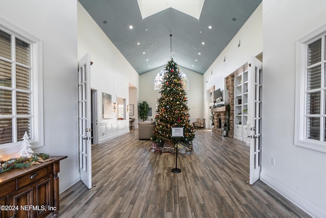 8550 Touchton Rd Unit 1226, Jacksonville, FL 32216 - interior space with french doors, dark wood-type flooring, high vaulted ceiling, and a skylight