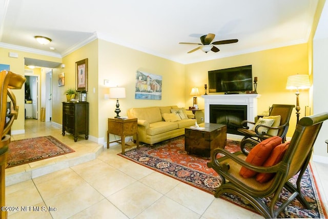 tiled living room featuring ceiling fan and ornamental molding