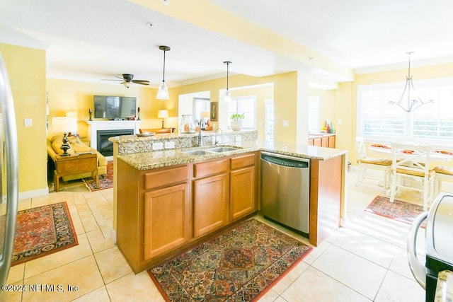 kitchen with ceiling fan, sink, stainless steel dishwasher, an island with sink, and pendant lighting