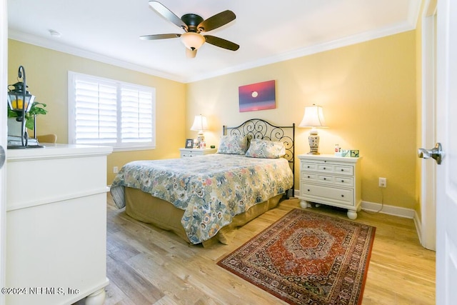 bedroom with ceiling fan, light wood-type flooring, and ornamental molding