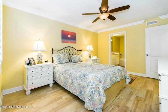 bedroom with ceiling fan, light wood-type flooring, crown molding, and connected bathroom