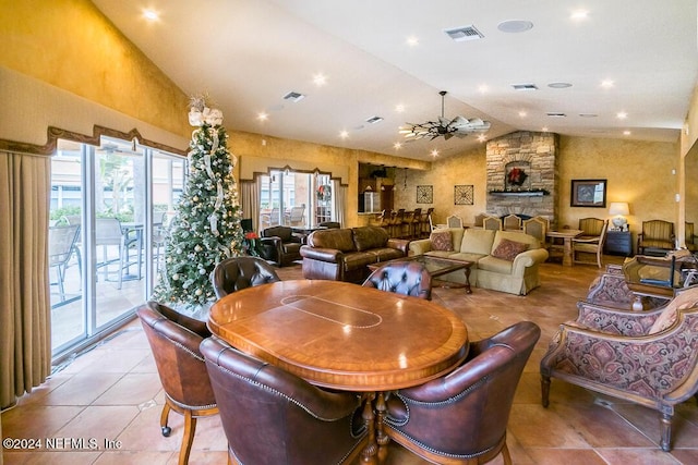 dining area with a fireplace, light tile patterned floors, vaulted ceiling, and ceiling fan