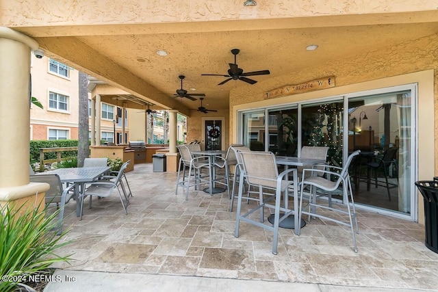 view of patio / terrace featuring ceiling fan