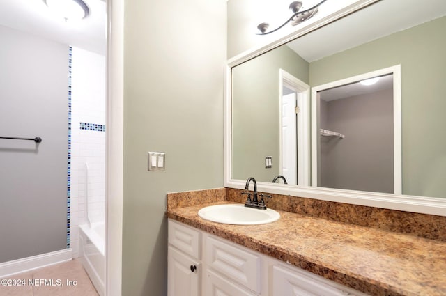 bathroom with tile patterned floors and vanity