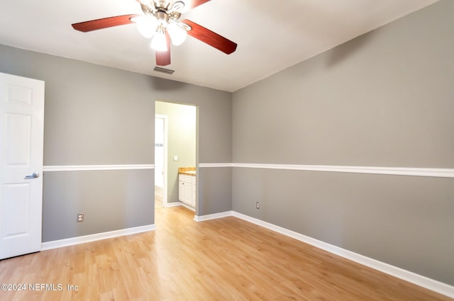 unfurnished room with ceiling fan and light hardwood / wood-style flooring