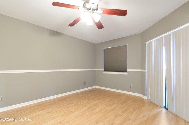 spare room featuring hardwood / wood-style floors and ceiling fan