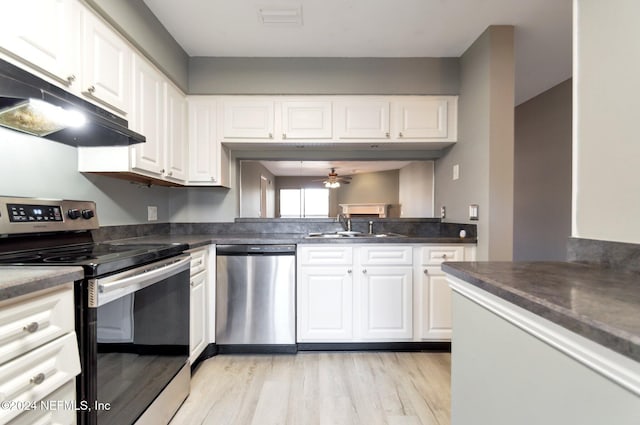 kitchen with white cabinets, ceiling fan, appliances with stainless steel finishes, and light hardwood / wood-style flooring