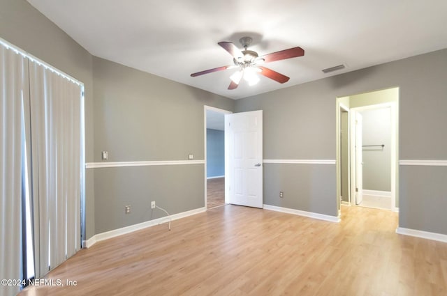 unfurnished bedroom featuring light hardwood / wood-style flooring and ceiling fan