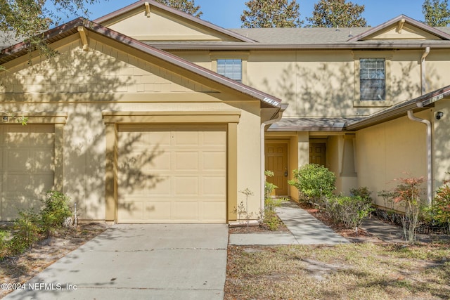 view of front of property with a garage