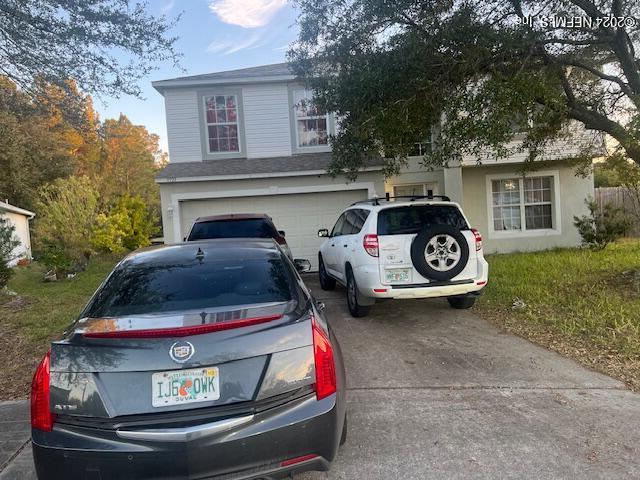 view of front of property featuring a garage