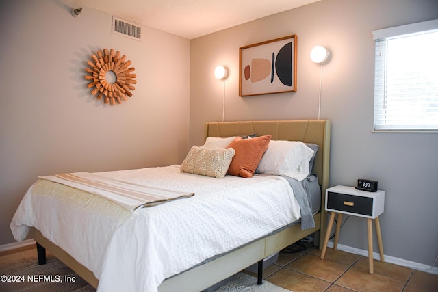 bedroom featuring tile patterned flooring