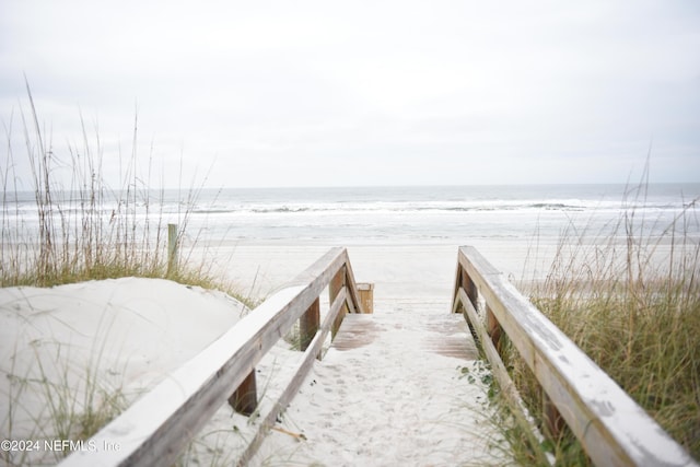 surrounding community featuring a water view