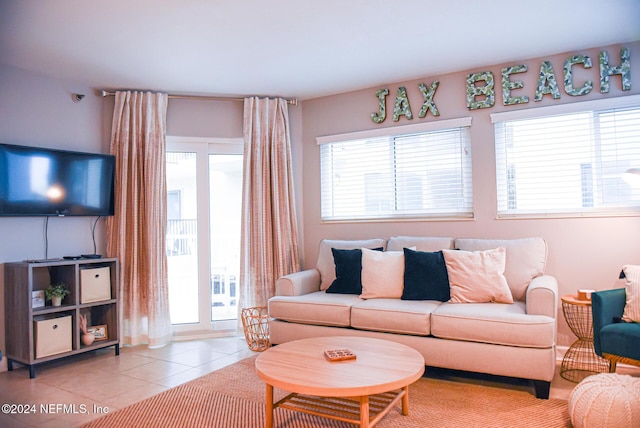 living room with plenty of natural light and light tile patterned flooring