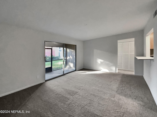 unfurnished living room with carpet