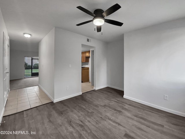 spare room featuring hardwood / wood-style floors and ceiling fan