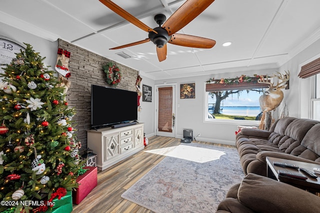 living room with ceiling fan, crown molding, and hardwood / wood-style flooring