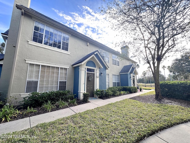 front facade with a front lawn