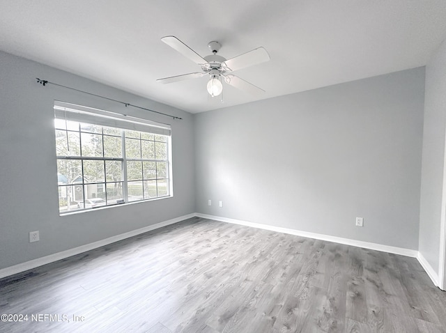 unfurnished room featuring ceiling fan and wood-type flooring