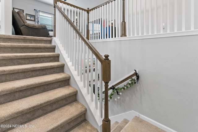 staircase with carpet