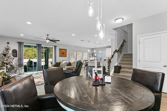 dining space featuring light hardwood / wood-style flooring, a wealth of natural light, and ceiling fan