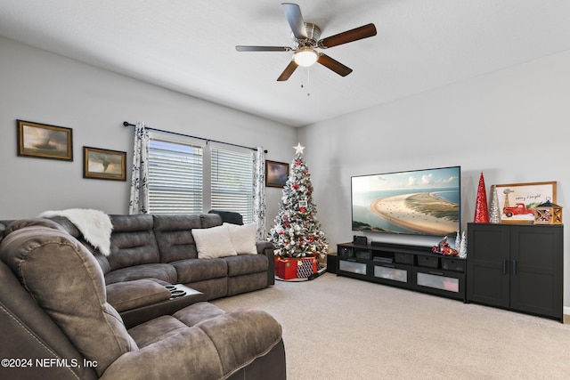 carpeted living room featuring ceiling fan