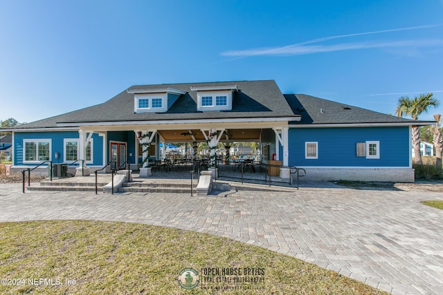 back of house featuring ceiling fan and a patio area