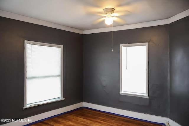 unfurnished room featuring crown molding, ceiling fan, and dark hardwood / wood-style flooring