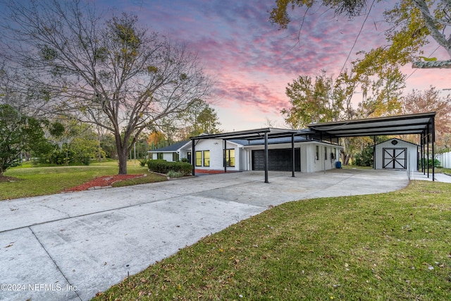 ranch-style home with a carport and a lawn