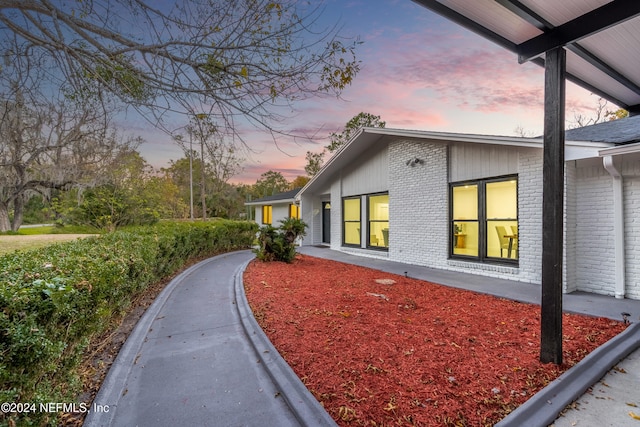 view of property exterior at dusk