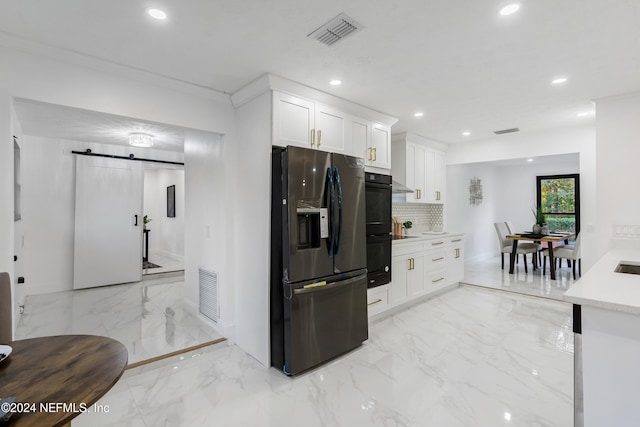 kitchen with white cabinetry, tasteful backsplash, double oven, crown molding, and stainless steel fridge