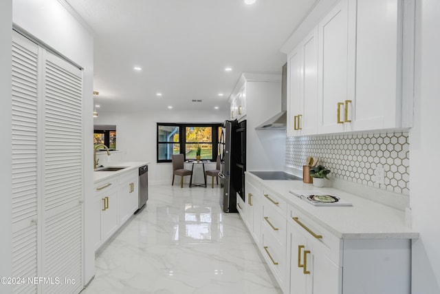 kitchen featuring white cabinets, sink, stainless steel dishwasher, wall chimney exhaust hood, and black electric cooktop