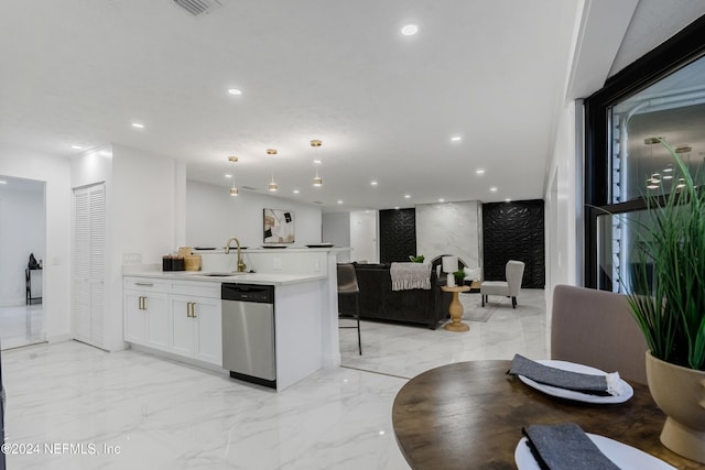 kitchen with a center island, dishwasher, hanging light fixtures, sink, and white cabinets