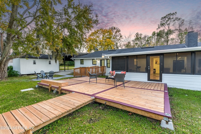 exterior space with a sunroom and a yard