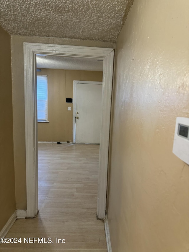 corridor featuring light hardwood / wood-style floors