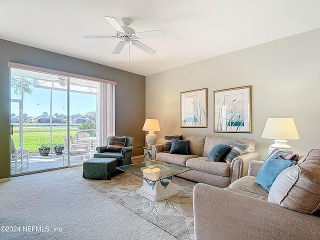 living room featuring light colored carpet and ceiling fan