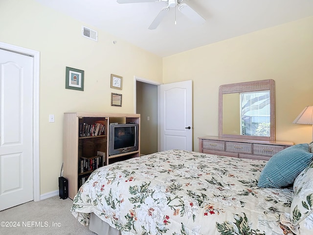 bedroom with light carpet and ceiling fan