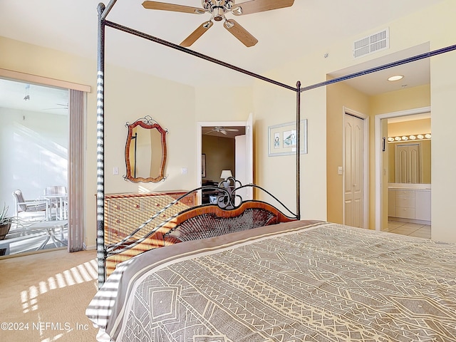 carpeted bedroom with access to outside, ensuite bath, ceiling fan, and a closet