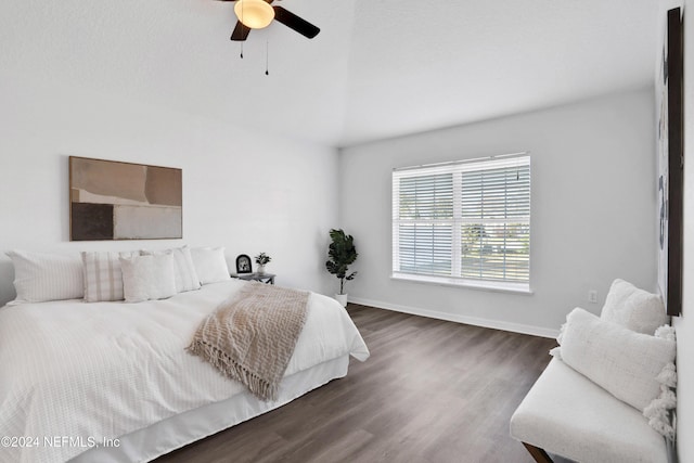 bedroom with ceiling fan and dark hardwood / wood-style flooring