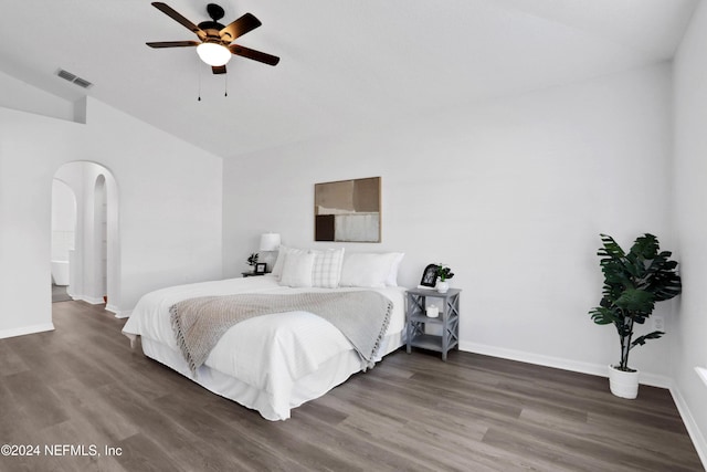 bedroom with ceiling fan, dark hardwood / wood-style flooring, and vaulted ceiling