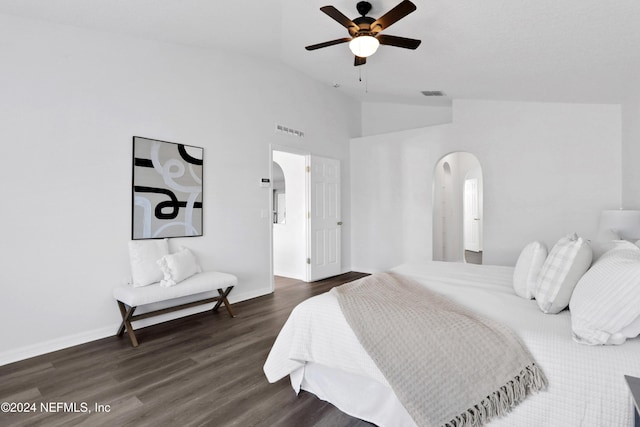 bedroom featuring ceiling fan, dark hardwood / wood-style flooring, and high vaulted ceiling