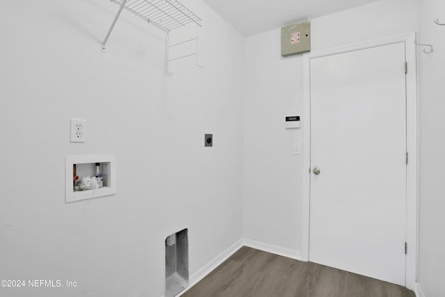 clothes washing area with hookup for a washing machine, electric dryer hookup, a textured ceiling, and dark wood-type flooring