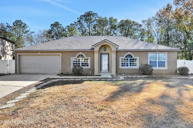 ranch-style house featuring a garage