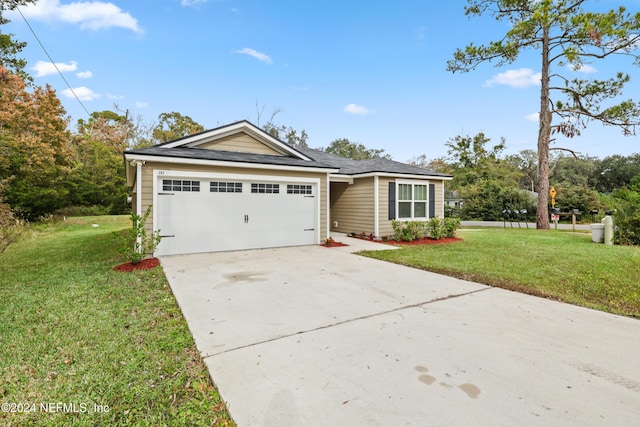 single story home with a garage and a front yard