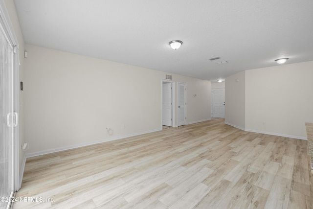 unfurnished room featuring light wood-type flooring