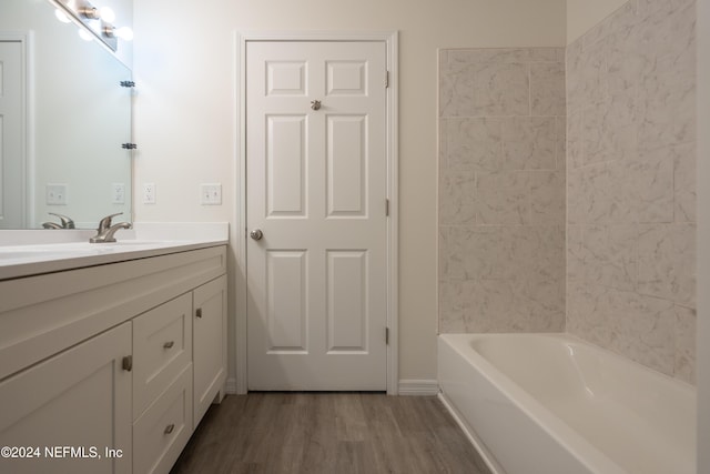 bathroom with vanity and hardwood / wood-style flooring