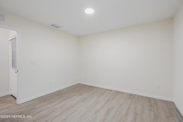 empty room with light wood-type flooring