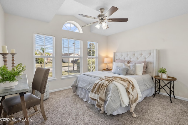 bedroom featuring light carpet, vaulted ceiling, and ceiling fan