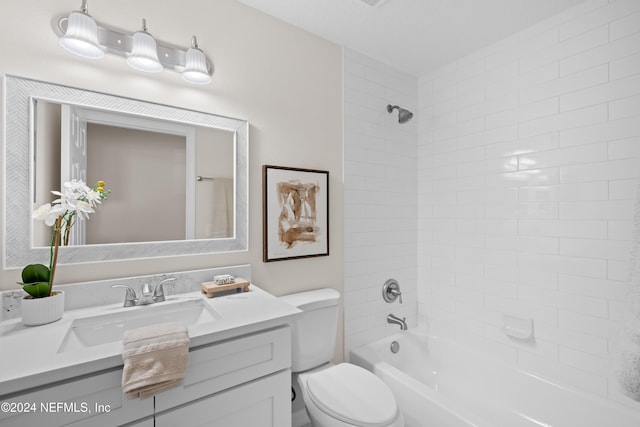 full bathroom featuring vanity, toilet, and tiled shower / bath